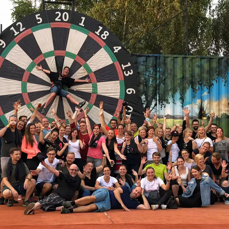 Group of people celebrating after a fun game of bubble football.