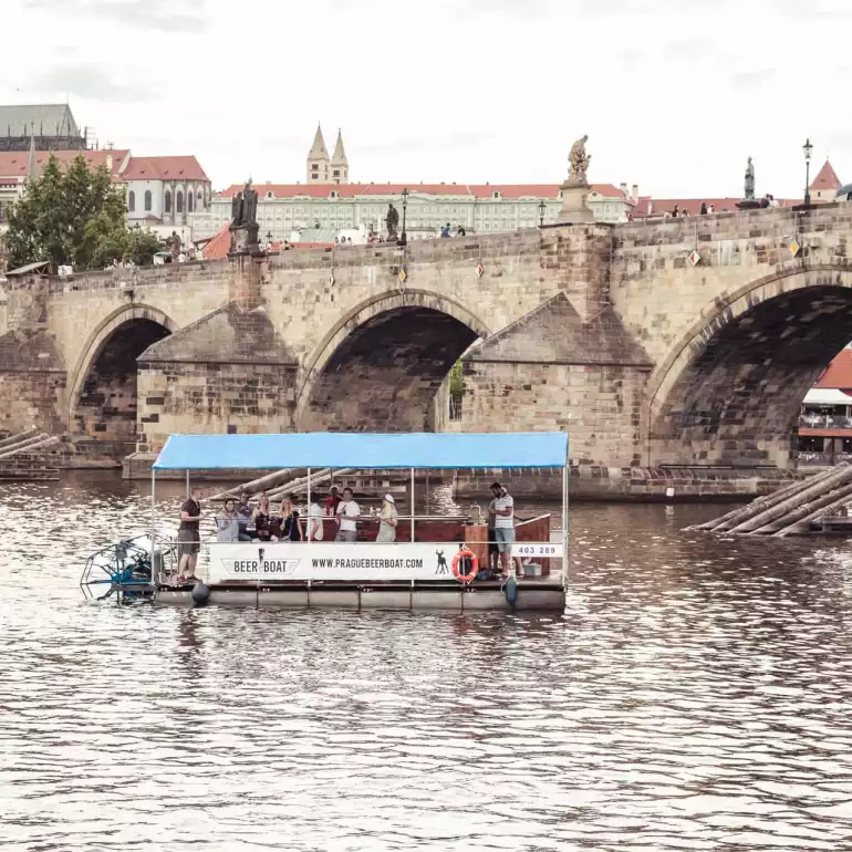 Prague party boat floating on Vltava river.