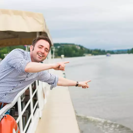 A guy enjoying a river-cruise in Budapest.