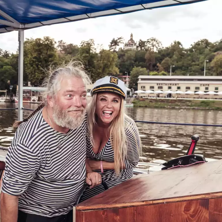 Beer boat captains enjoying a ride on Vltava river.